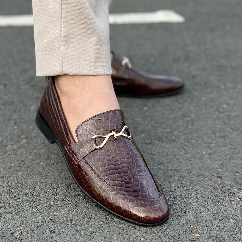A man's foot wearing a brown premium leather handmade shoe Main image